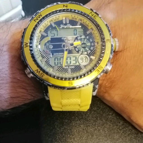 Watch with yellow strap missing one button, works