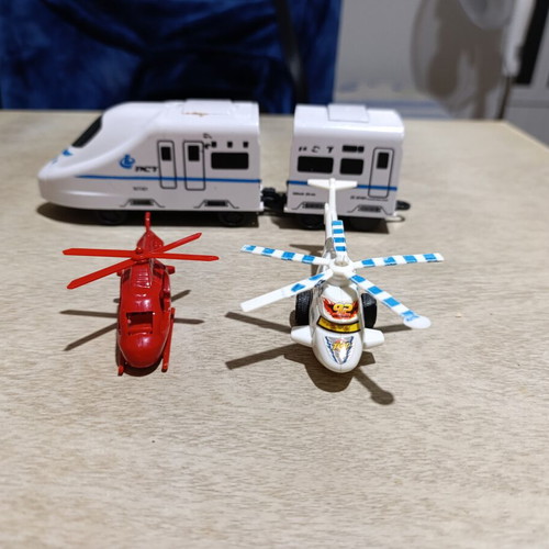 Plastic helicopter and train figures used