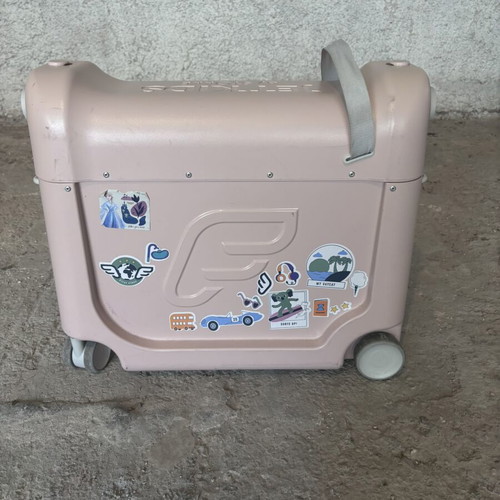 Stokke pink suitcase used with broken wheel part