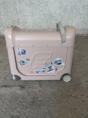 Stokke pink suitcase used with broken wheel part