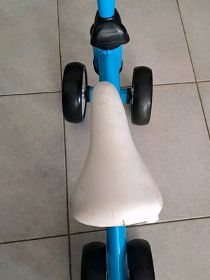 Balance bike for children used, blue and white, metal frame