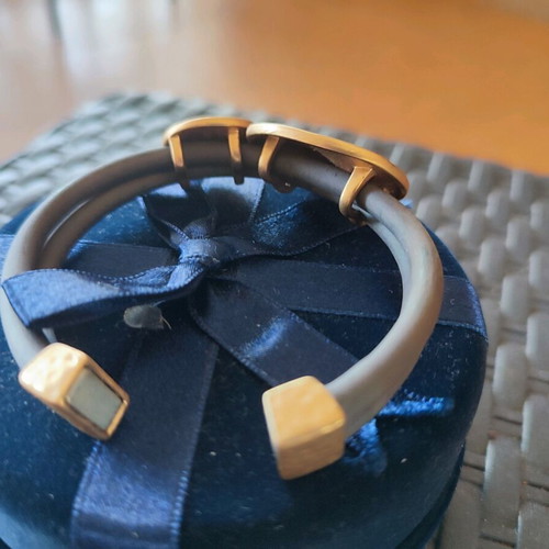 Bracelet with magnetic clasp, leather strap, gold-plated designs, like new