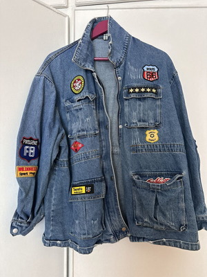 Women's oversized denim jacket with colorful patches