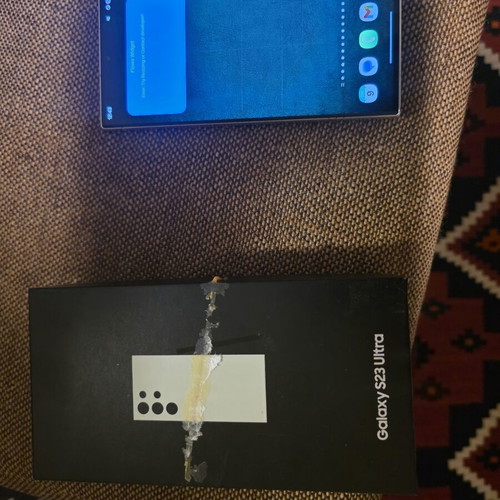 Samsung Galaxy S23 Ultra 256GB smartphone used, with 3 cases