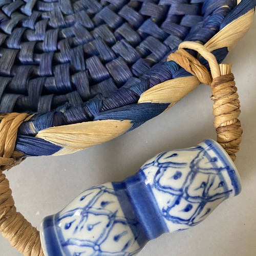 Blue handmade wicker basket with painted porcelain handles like new