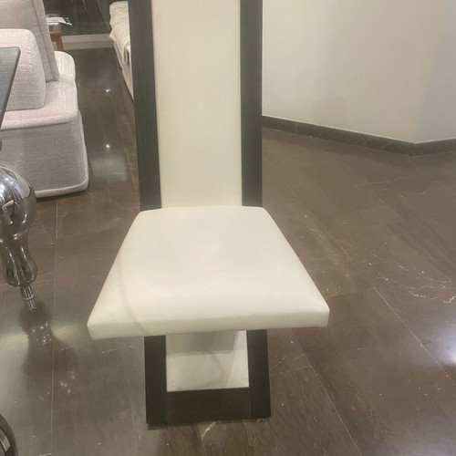 Glass dining table with 6 used Italian leather chairs, inox legs