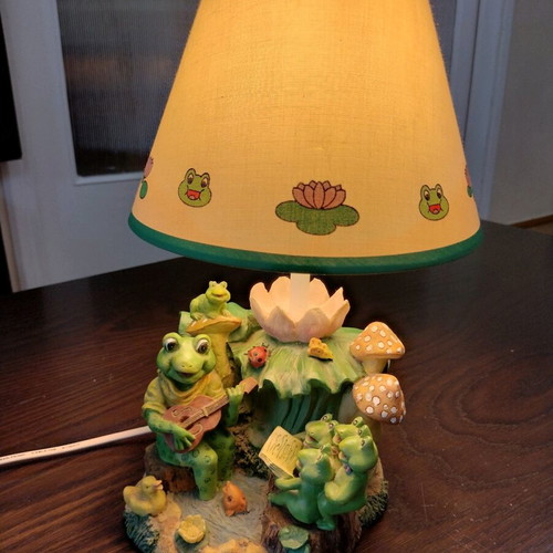 Table lamp used with decorative frog figurines
