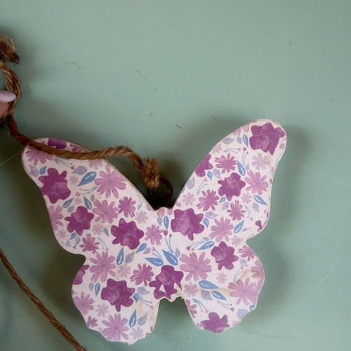Handmade hanging decoration with butterfly, heart and flower wooden motifs
