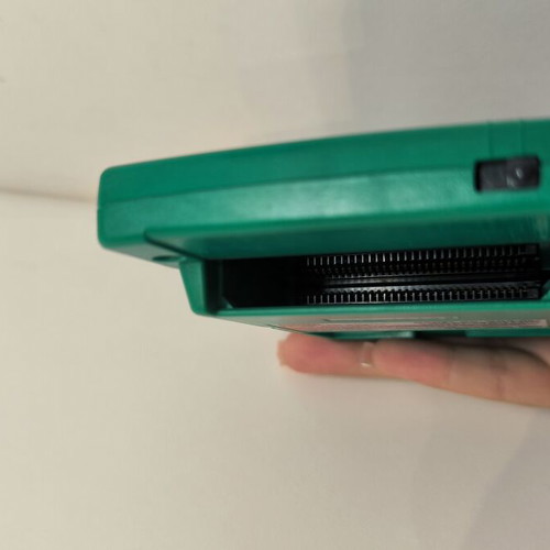 Game Boy Pocket Green console used with Test Drive 6 game