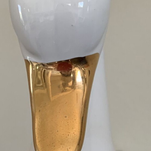 Vintage ceramic swan pair with glossy white finish and gold beak