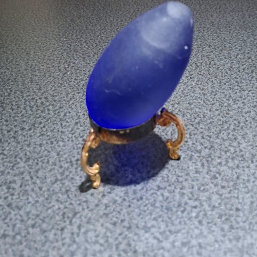 Vintage decorative crystal egg with blue matte glass and gold metal base used