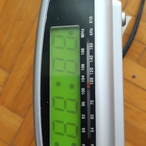 Digital alarm clock used with radio and minor display lines