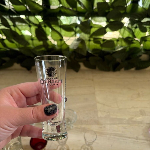 Set of 9 shot glasses like new, various designs