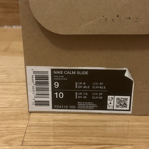 Nike men's white Calm slides size 42.5, used with signs of wear