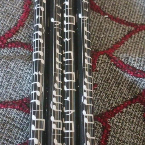 Set of 4 black pencils with musical notes