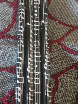 Set of 4 black pencils with musical notes