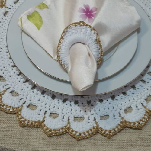 Elegant handmade white table set with gold details and napkin rings