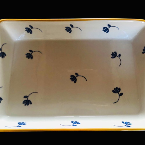 Rectangular Pyrex used with blue flowers and wicker base
