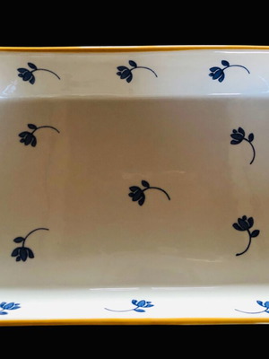 Rectangular Pyrex used with blue flowers and wicker base