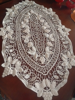 Antique handmade crochet table linen with grape cluster design used