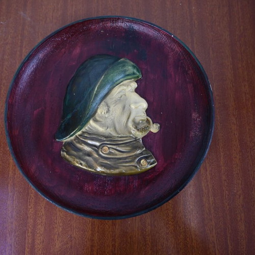 Vintage decorative wall plate with embossed male profile used