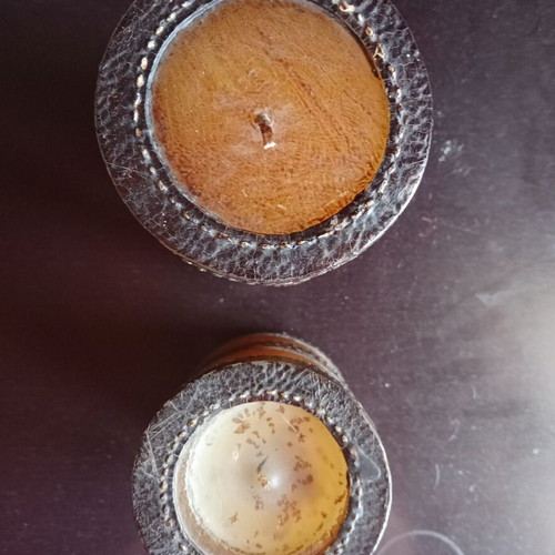 Set of two decorative candles with belt motif, brown and olive