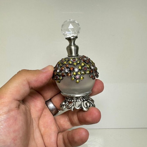 Vintage glass perfume bottle with floral enamel decoration