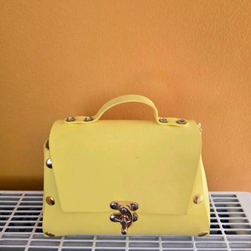 Women's yellow shoulder bag made of foam, used
