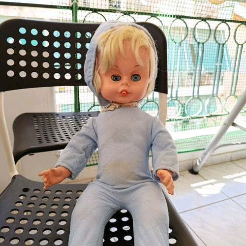 Vintage baby doll used with missing parts and wear