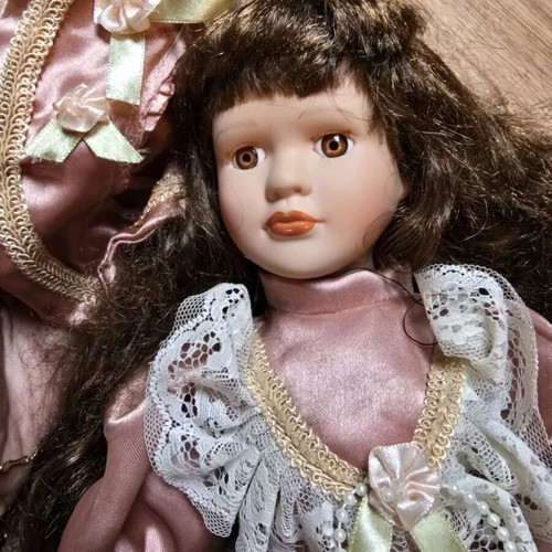 Glass doll like new with satin rotten apple dress and hat