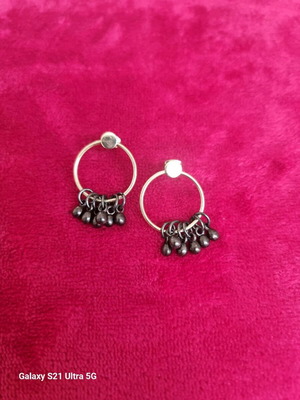 Gold-plated hoop earrings with hanging details like new
