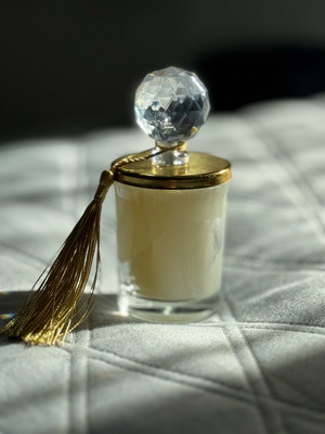 Decorative candle new, slightly melted due to temperature