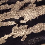 Black and silver rug with embossed designs 216x155 cm