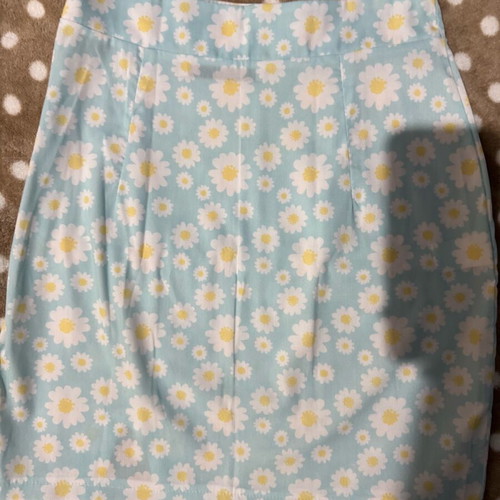 Mini skirt with daisies on blue background, size S, like new