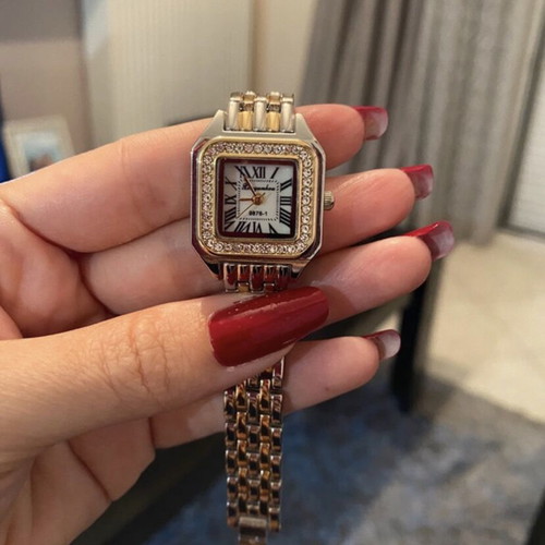 Silver wristwatch with new battery, women's