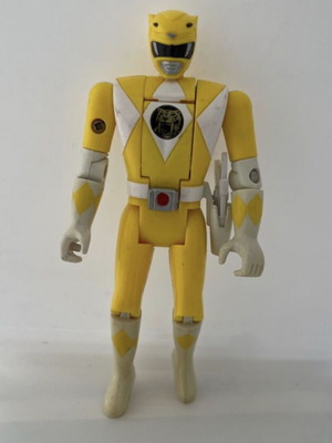 Yellow Power Ranger action figure used with weapon
