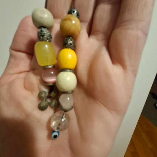 Worry beads used with colorful beads, evil eye and metal element