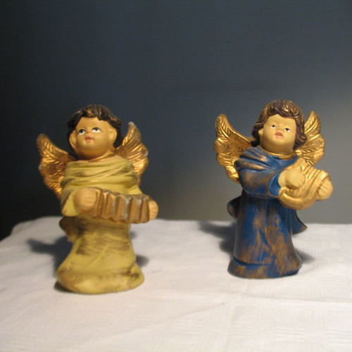 Pair of old clay angels like new