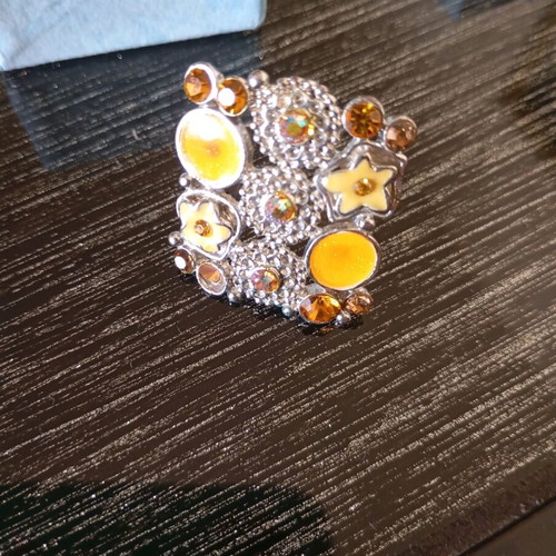 Adjustable ring like new, steel, yellow and orange