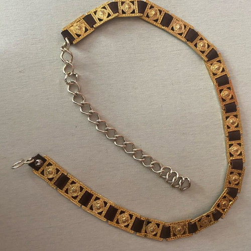 Belt with golden metal details on brown leather, like new