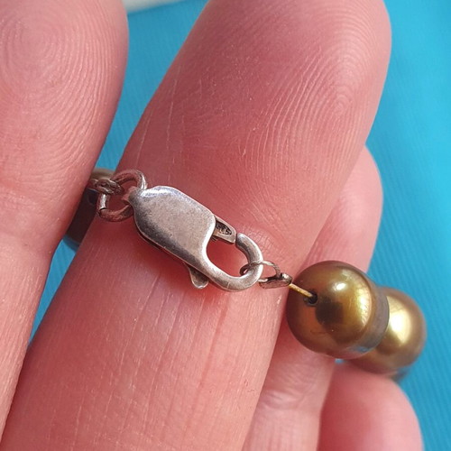 Necklace with natural pearls like new, khaki color, silver clasp