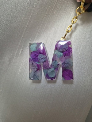 Handmade monogram keychain from resin custom made with purple and turquoise flowers