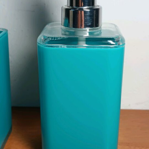 Soap dispenser and toothbrush holder used