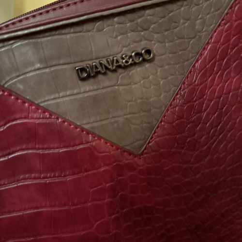Burgundy embossed women's handbag with geometric details