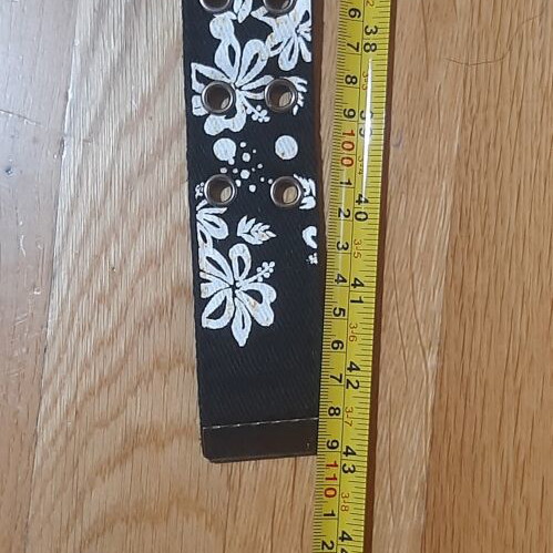 Belt like new, black with white floral pattern, size 110
