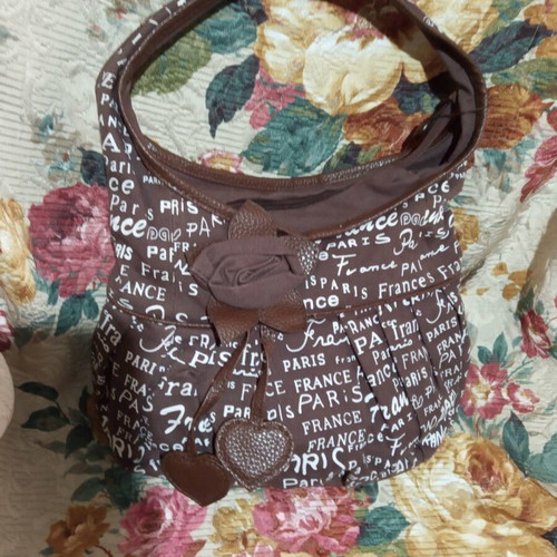 Fabric bag with decorative flower