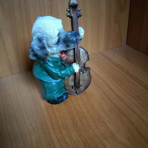 Decorative dog figure with cello like new