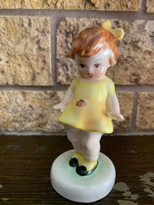 Ceramic figurine of little girl with ladybird used, vintage