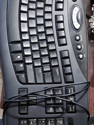 Microsoft computer keyboard used with two missing keys