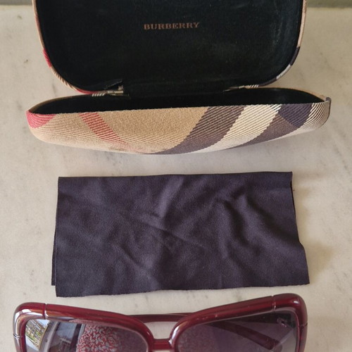 Burberry women's sunglasses used, burgundy with case